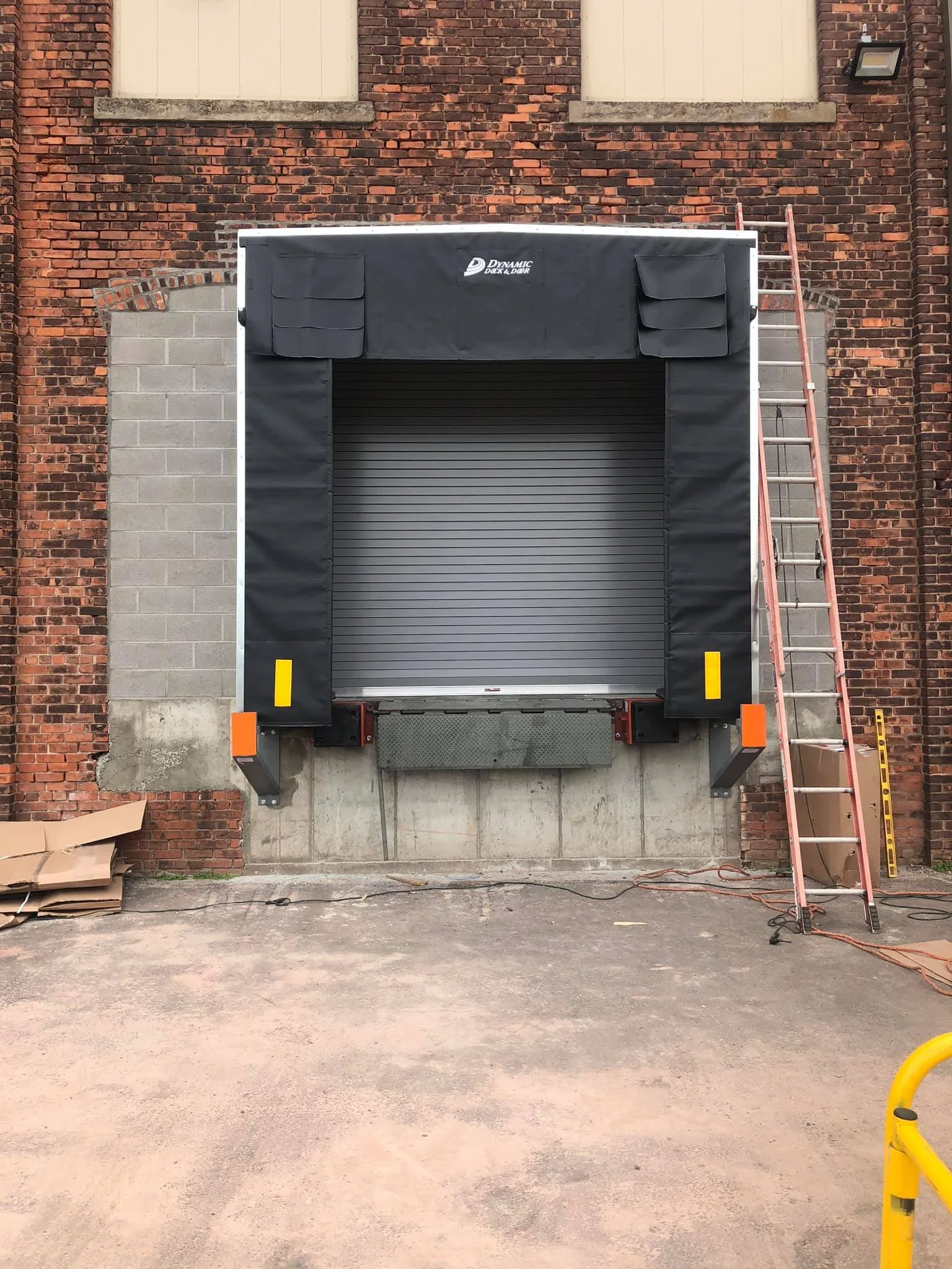 Commercial rolling door at a loading area shown for planning context